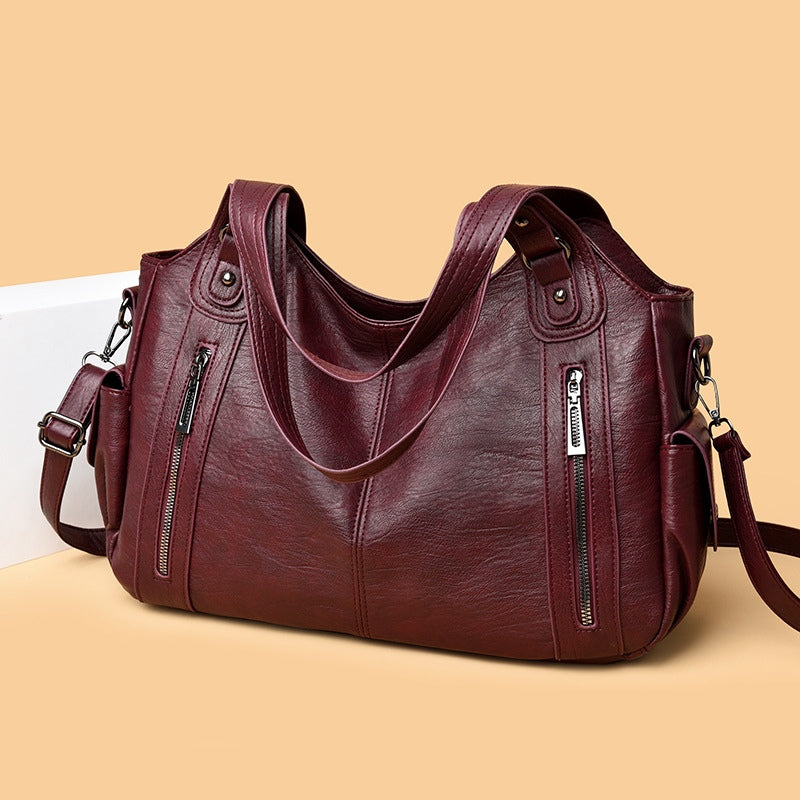 Borsa tote di lusso con dettagli a borchie e ampia capacità