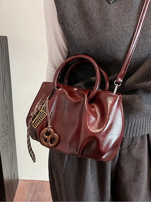 Borsa a tracolla leggera con motivo di nuvole plissettate
