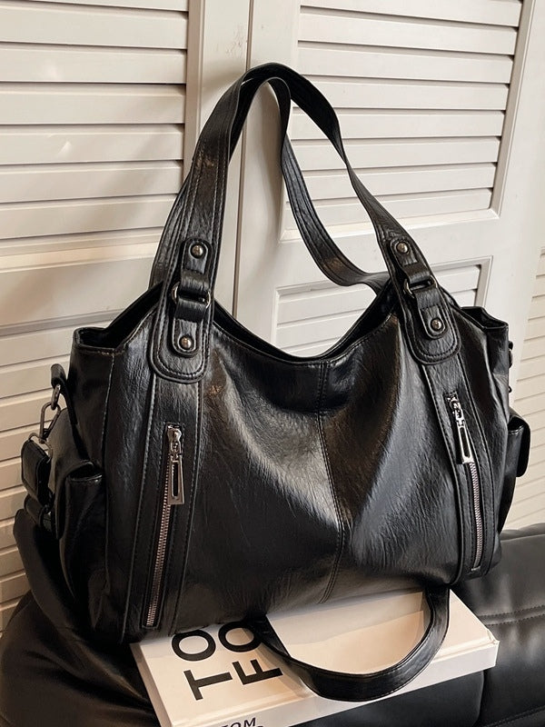 Borsa tote di lusso con dettagli a borchie e ampia capacità