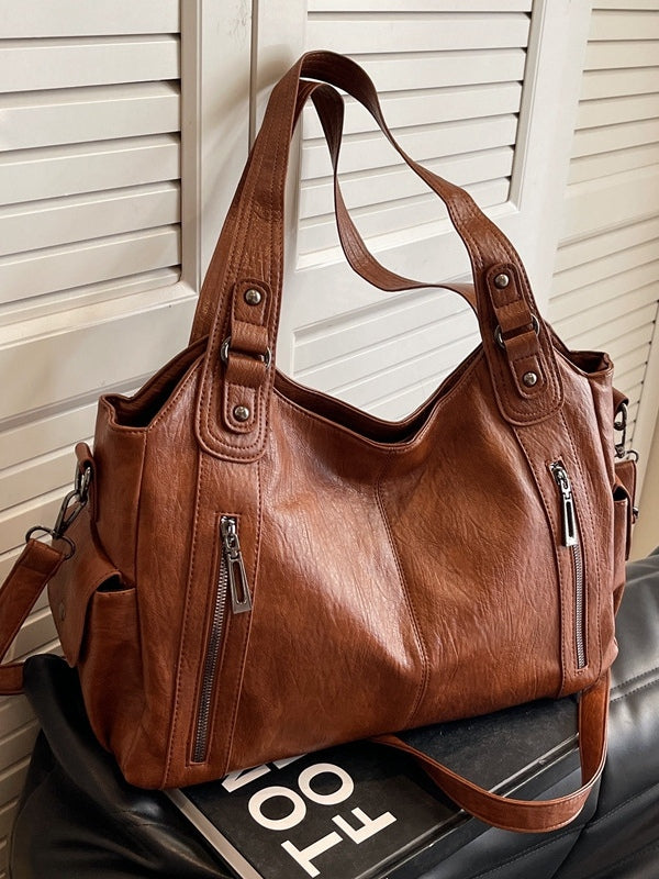Borsa tote di lusso con dettagli a borchie e ampia capacità