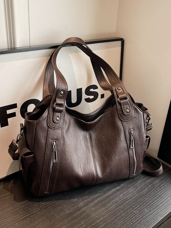 Borsa tote di lusso con dettagli a borchie e ampia capacità
