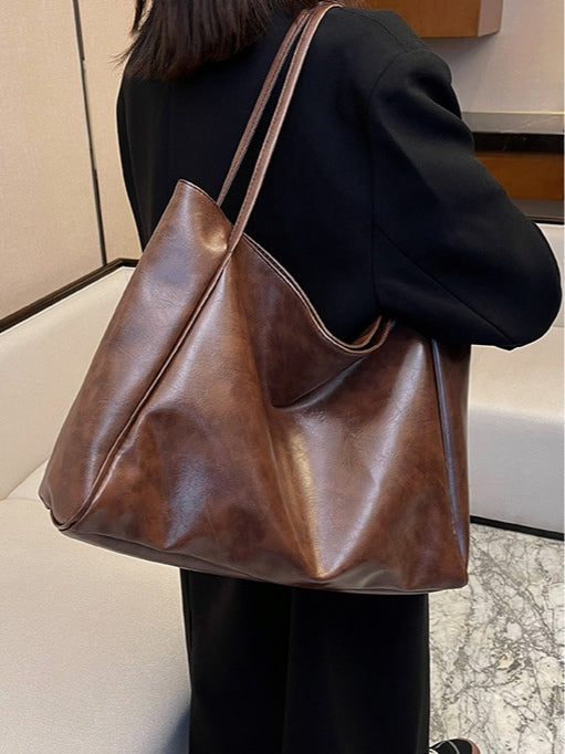 Borsa a secchiello in pelle morbida con tracolla spaziosa