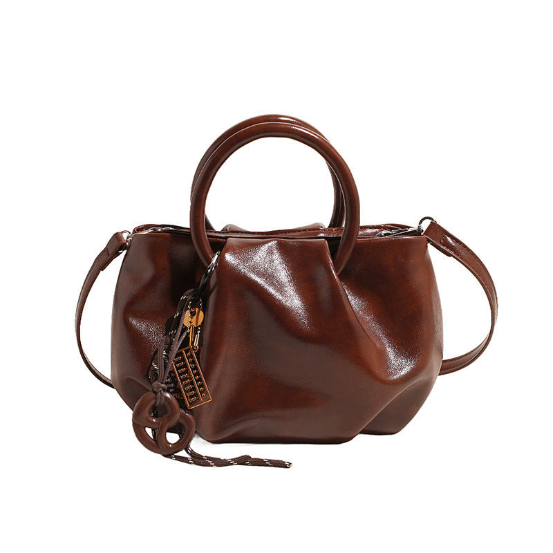 Borsa a tracolla leggera con motivo di nuvole plissettate