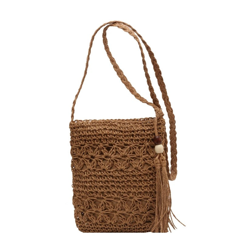 Borsa Alma in rafia intrecciata con tracolla incrociata, l'accessorio ideale per l'estate